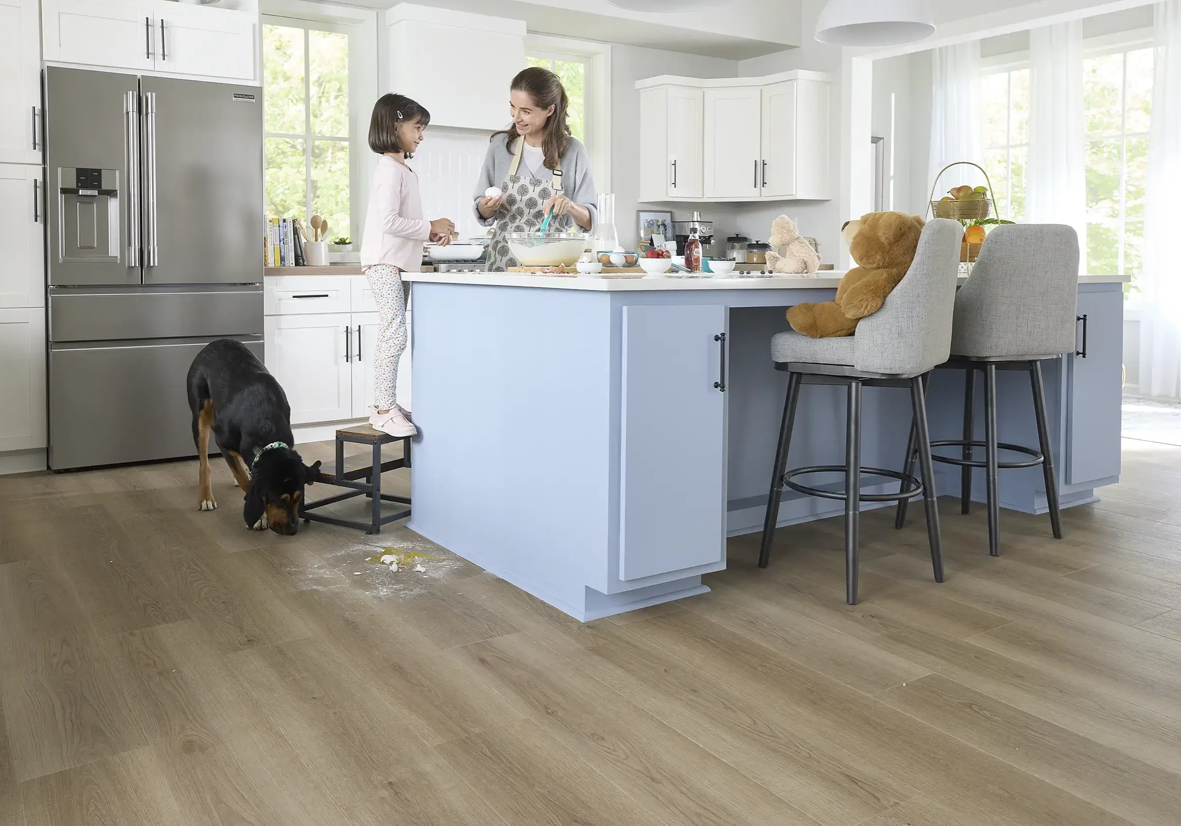 Lady and kid giving bath to dog