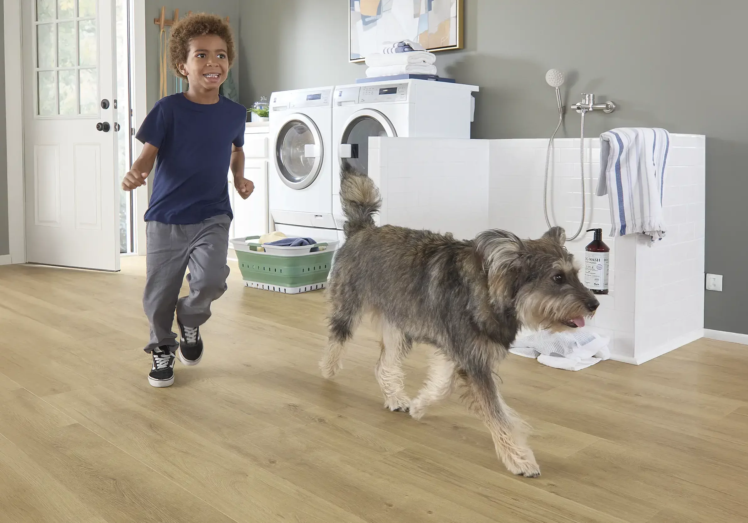 Lady and kid giving bath to dog